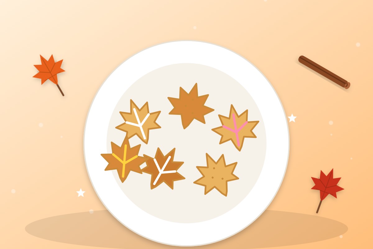 Plato con galletas en forma de hoja de otoño, algunas decoradas con glaseado