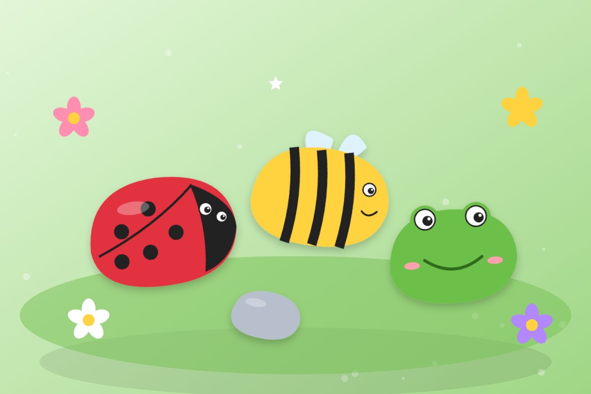 Tres piedras pintadas como una mariquita, una abeja y una rana sobre la hierba